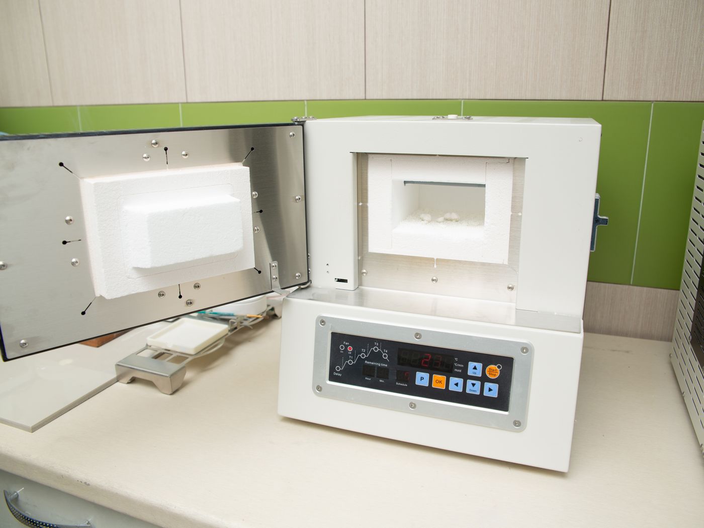Dental models with ceramic restorations on a laboratory workbench